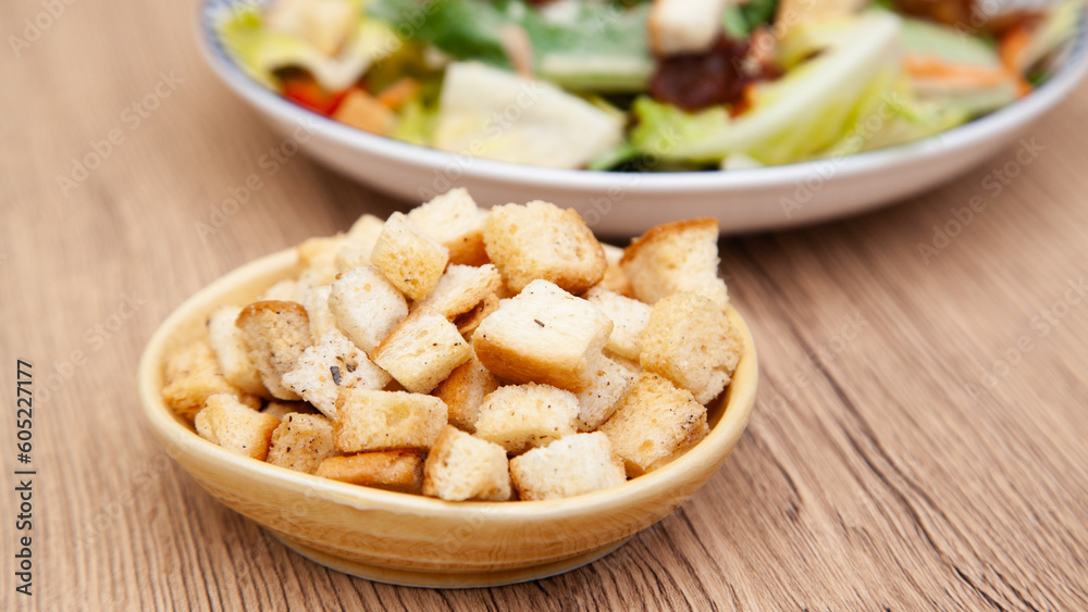 Fresh baked crouton, crispy bread with garlic and oregano for salad and soup Fresh baked crouton, crispy bread with garlic and oregano for salad and soup