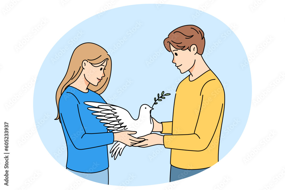 Fototapeta premium Man and woman holding dove in hands