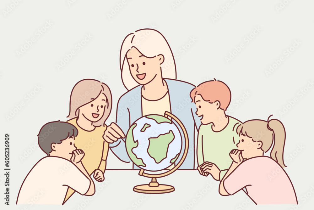 Teacher with children near globe study geography during lesson in elementary school Teacher with children near globe study geography during lesson in elementary school