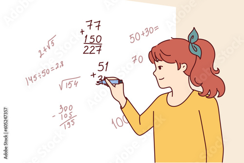 Teenager girl writes complex mathematical formulas on blackboard solving problems from higher mathematics or algebra. Little child prodigy schoolgirl participates in math olympiad.