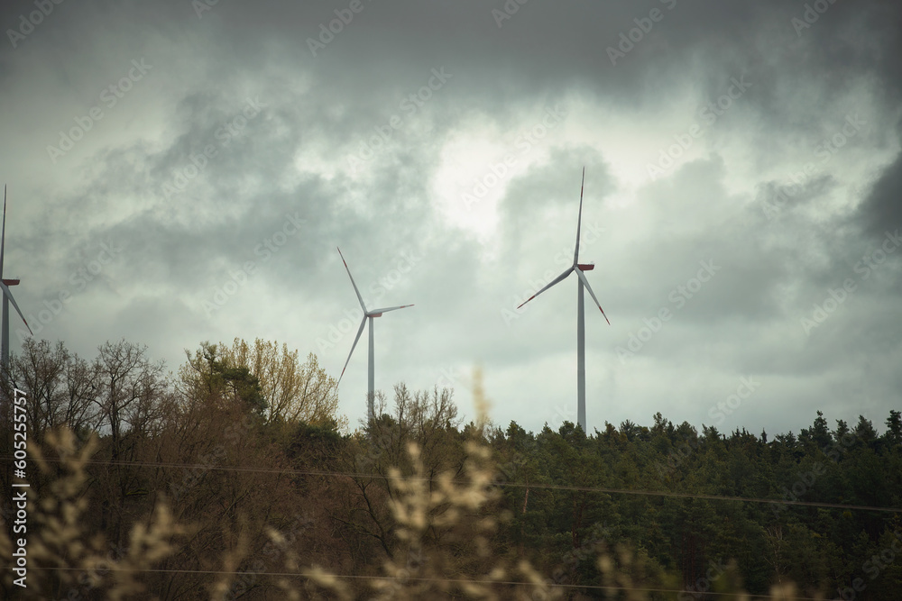 Wind Turbines against the sky. Wind turbines in Europe. Concept of sustainable and green future Wind Turbines against the sky. Wind turbines in Europe. Concept of sustainable and green future