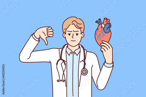 Man doctor for heart disease showing thumb down recommending taking medication or leading healthy lifestyle. Concept negative cardiac tests for patient and poor health of heart and circulatory system