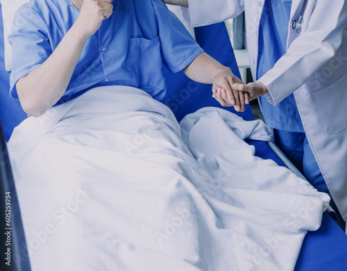 Asian caregiver doctor examine older patient use blood pressure gauge. Young woman therapist nurse at nursing home taking care of senior elderly woman sit on sofa. Medical insurance service concept