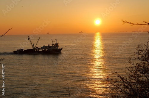 boat at sunset © ozgur