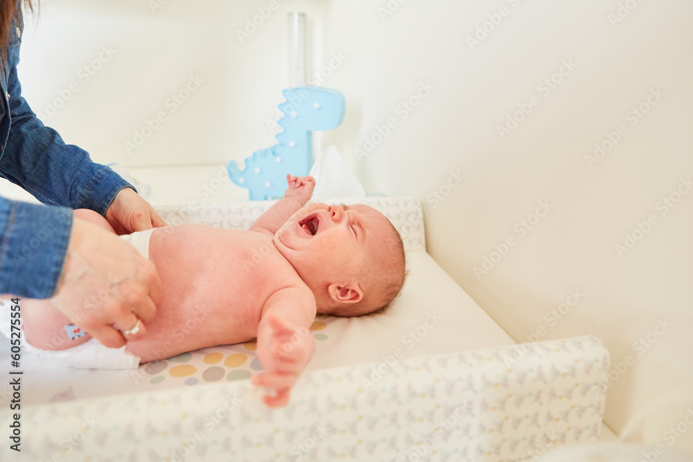 Crying baby while changing diaper Stock Photo Adobe Stock
