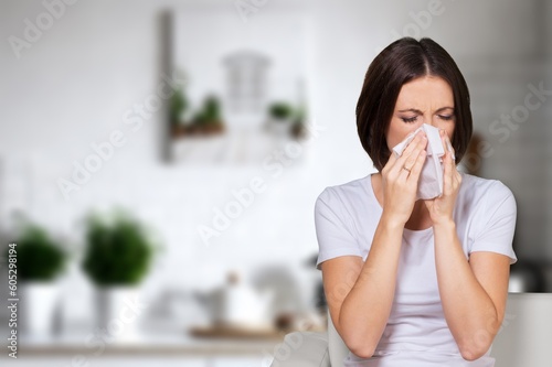 Murais de parede Sad young woman hold tissue sneeze