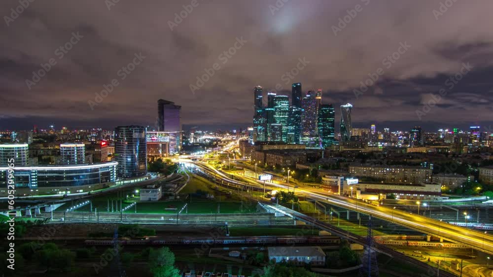 Night panorama of the city traffic timelapse and Building of Moscow International Business Center (Moscow-City). Aerial top view from rooftop near Kievskiy railway station Night panorama of the city traffic timelapse and Building of Moscow International Business Center (Moscow-City). Aerial top view from rooftop near Kievskiy railway station