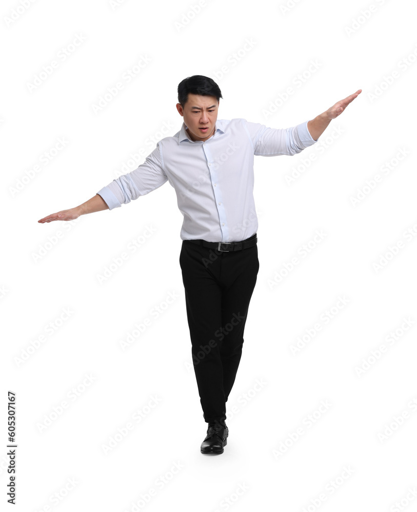 Businessman in formal clothes posing on white background
