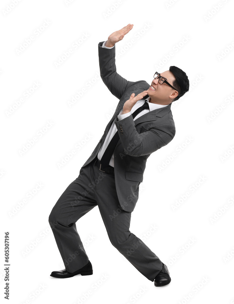 Scared businessman in suit posing on white background