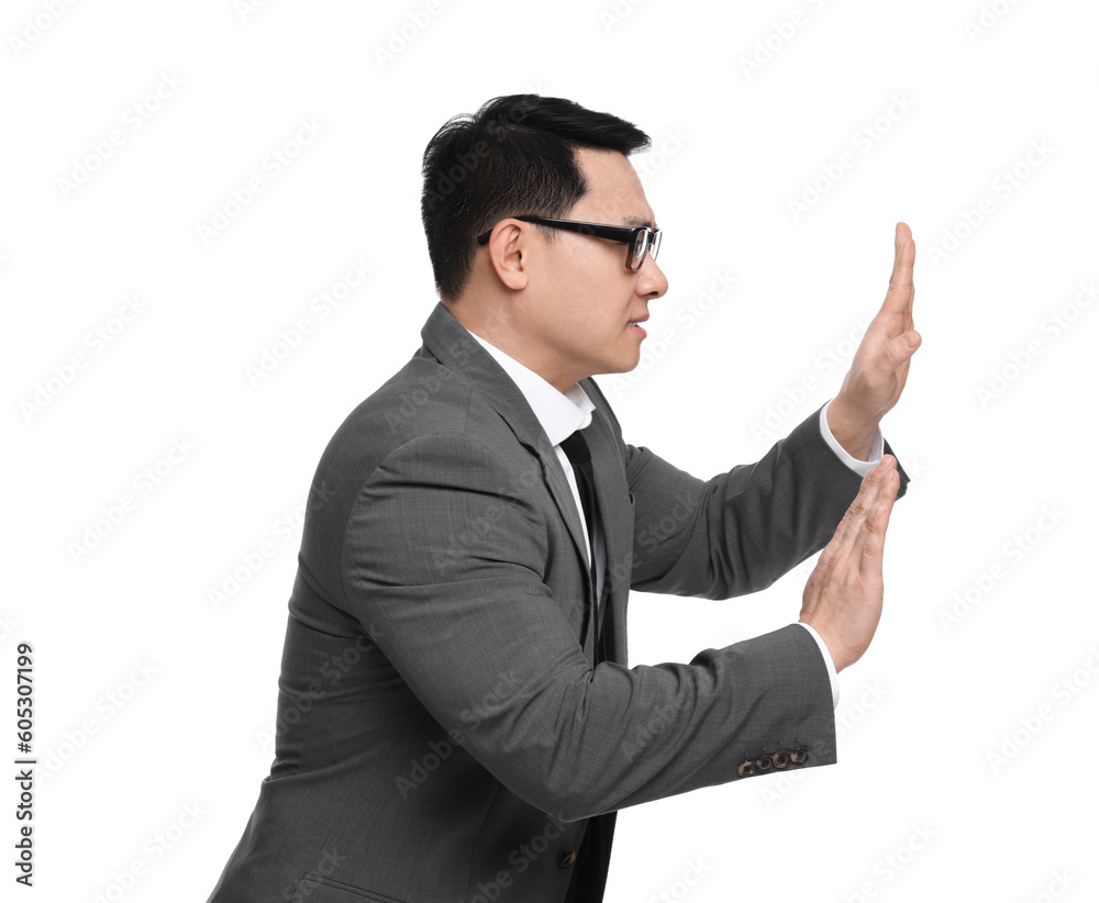 Scared businessman in suit posing on white background Scared businessman in suit posing on white background