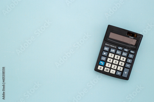 Business accounter working with calculator for taxes accounting photo