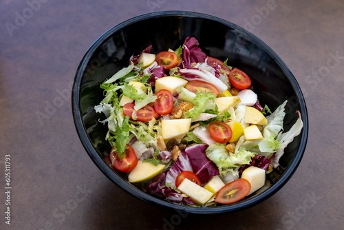Closeup of a fresh vegetable salad in a bowl served in a restaurant