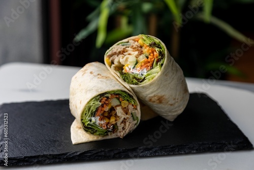 Closeup of lavash roll with meat and vegetables photo