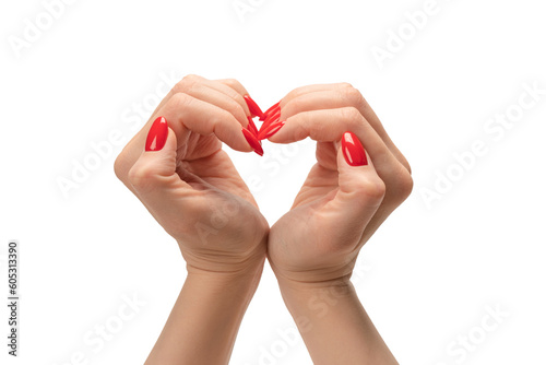 Close up of heart symbol made by woman hands with red nails isolated on white background.