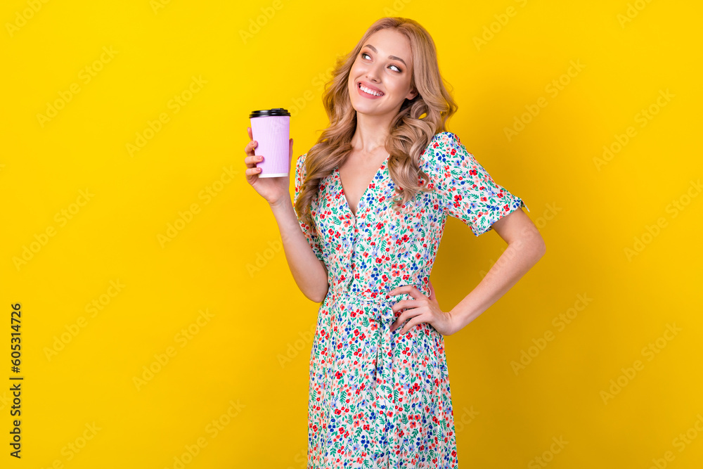 Photo of beautiful young lady wavy blonde hair hold cup tasty takeaway cacao look empty space coffee shop isolated on yellow background Photo of beautiful young lady wavy blonde hair hold cup tasty takeaway cacao look empty space coffee shop isolated on yellow background
