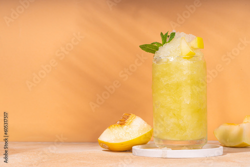 Melon slushie cocktail, Sweet summer refreshing crushed ice slush mocktail with melon juice, milt and lemon or lime