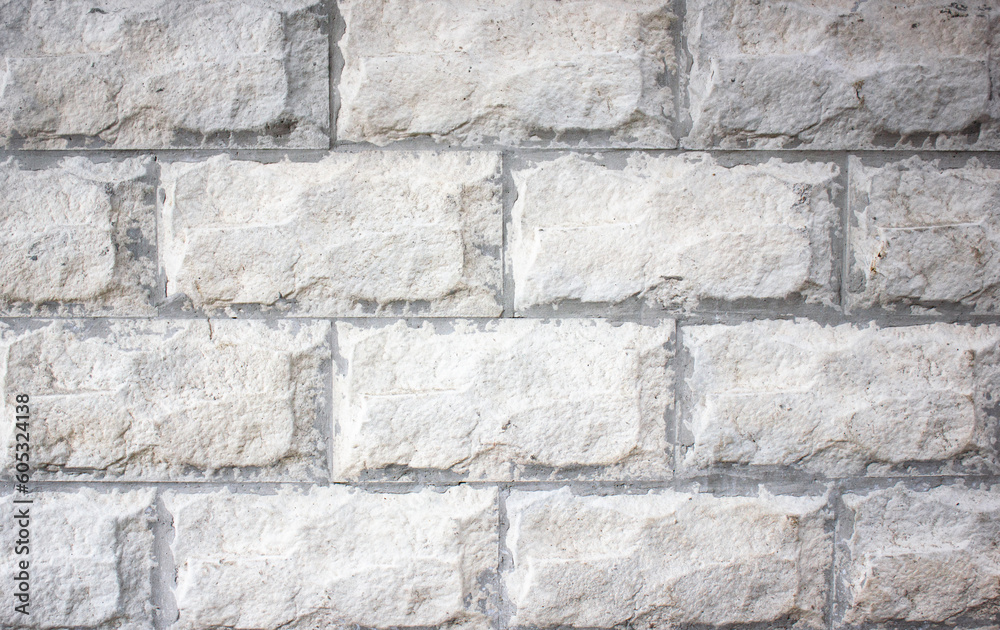 Stone blocks background.Old facing wall.Facade cover. light blocks. Stone blocks background.Old facing wall.Facade cover. light blocks.