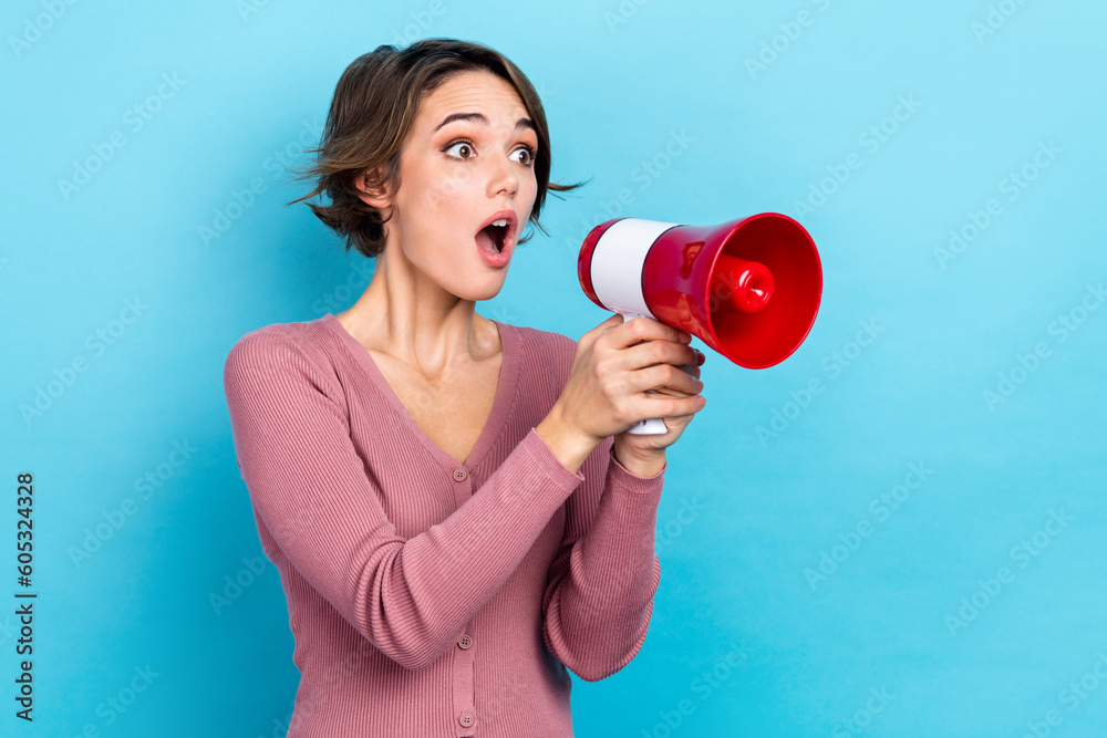 Photo of young crazy funny girl hold loudspeaker crazy scream voice promotion next protest support lgbt isolated on blue color background Photo of young crazy funny girl hold loudspeaker crazy scream voice promotion next protest support lgbt isolated on blue color background
