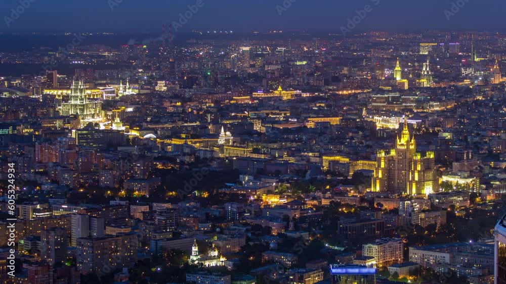 Aerial top view of Moscow night timelapse after sunset. Panorama from the observation platform of the business center of Moscow City. Illuminated stalin skyscrapers and traffic on road Aerial top view of Moscow night timelapse after sunset. Panorama from the observation platform of the business center of Moscow City. Illuminated stalin skyscrapers and traffic on road