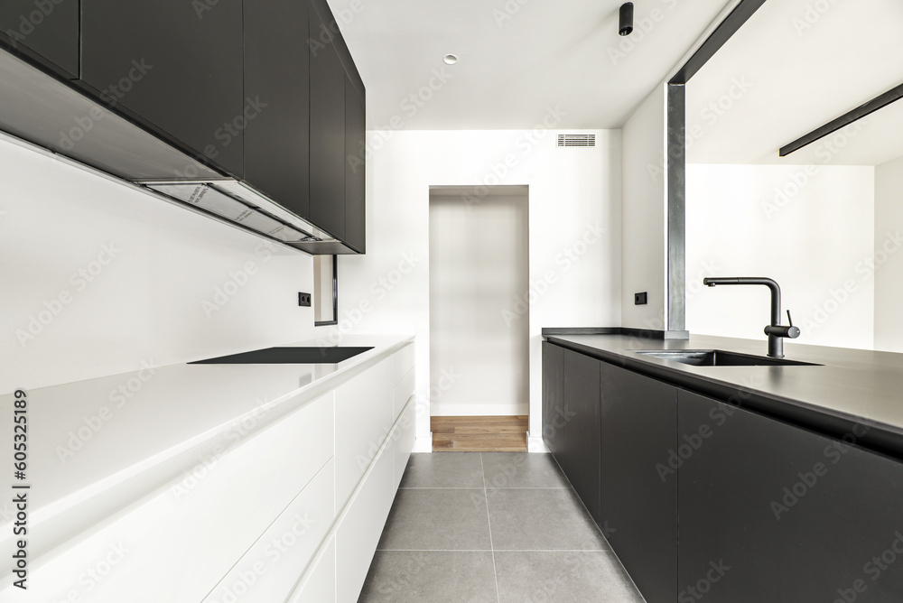 Kitchen furnished with a combination of black Kitchen furnished with a combination of black
