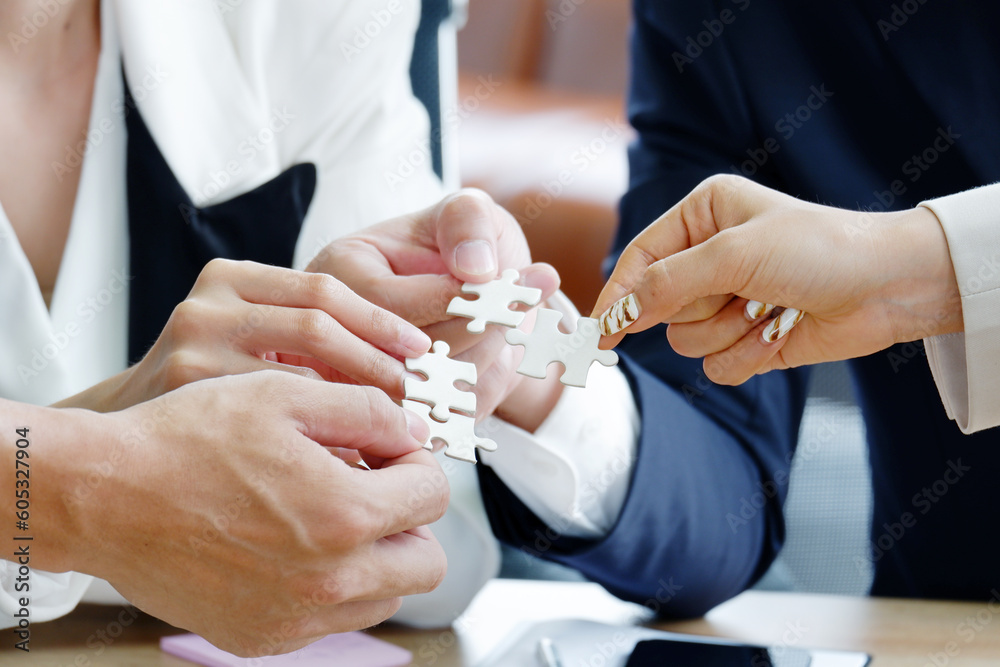 businessman hand holding jigsaw puzzle. businessman hand holding jigsaw puzzle.