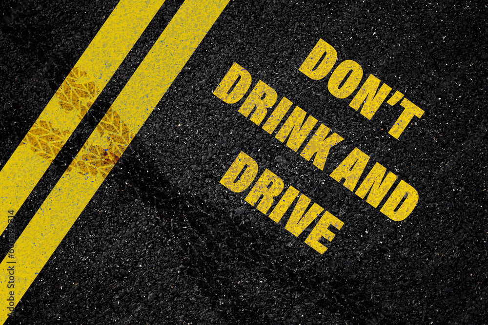 Don't Drink and Drive written on the road,Lane with the text Dont drink and drive