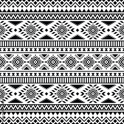 Seamless native pattern with unique tribal background design. Aztec Navajo ethnic style. Black and white colors. Design for textile, fabric, curtain, rug, batik, ornament, background, wrapping.