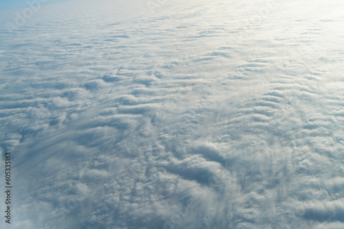 Aerial view on white fluffy clouds