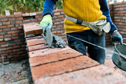 Wallpaper Mural Close up of bricklayer building walls Torontodigital.ca