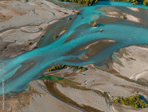 Aerial Drone View of braided river with glacial meltwater blue in New Zealand.