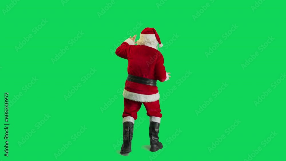 Studio Shot Isolated Mockup Template: Jolly Santa Claus Dancing On Green Screen Chromakey Background, Celebrating Christmas, New Years, Holiday Season. Happy And Joyful Celebration Of New Beginnings.