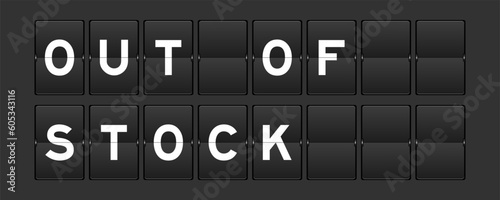 Black color analog flip board with word out of stock on gray background