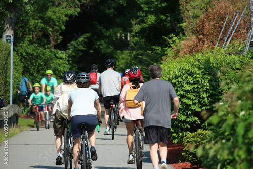 People cycling, Jogging and walking on the bikeway in the sunny day, Lexington, MA. USA.
