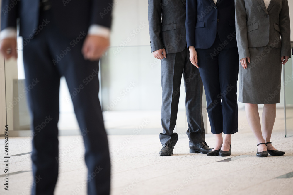 Image of promotion and jealousy within the company The feet of a businessman's suit no-face Image of promotion and jealousy within the company The feet of a businessman's suit no-face