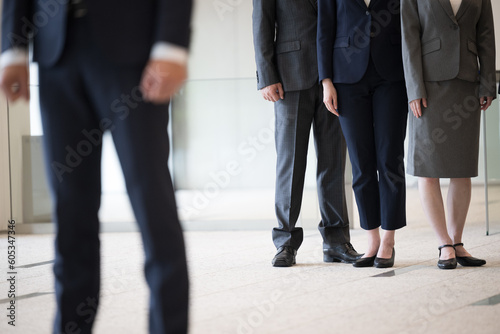 Image of promotion and jealousy within the company The feet of a businessman's suit no-face © kapinon