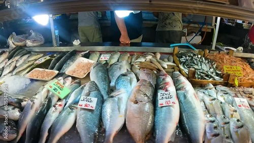 Fresh seafood, shellfish and fish in Fethiye Turkey Market. Camera panning across the market stalls with fish. Slow motion. Fresh fish on the counter at the fish market. High quality FullHD footage photo