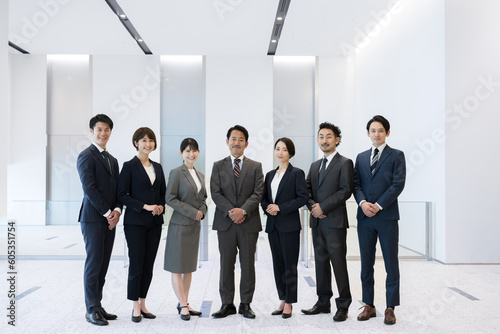 Several members of the businessman team posing with gusto All members gathered Front, with copy space above, serious expressions