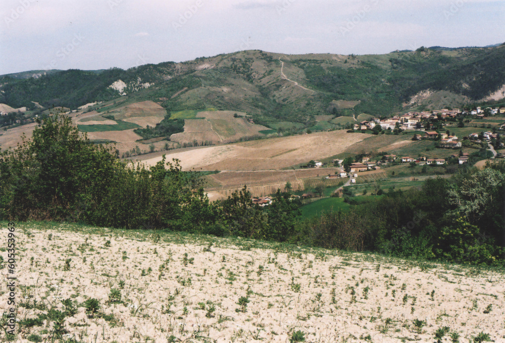 Obraz premium Beautiful Hill Landscape with a Small Village in Northern Italy during Spring. Fortunago, Pavia Province. Film Photography