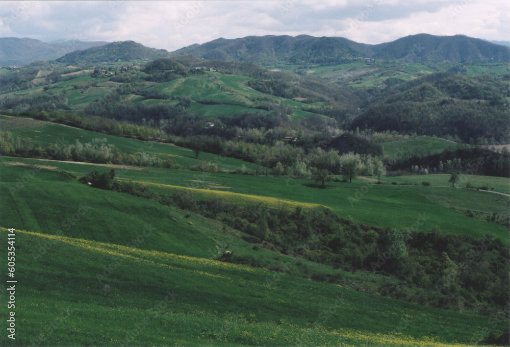 Beautiful Hill Landscape with Clouds during Spring. Fortunago, Pavia Province, Italy.  Film Photography
