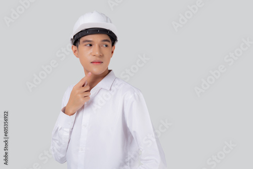 Portrait young asian engineer man wearing helmet thinking idea isolated white background, architect or contractor with planning and thoughtful, contractor consider with solution, industrial concept.