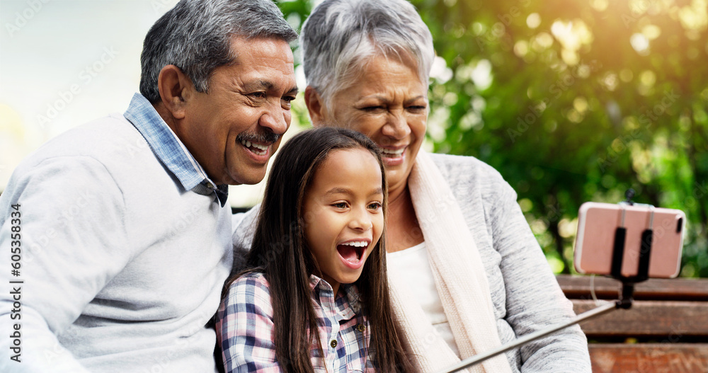 Laugh, grandparents and young girl take selfie at the park or senior woman or man and excited for picture with kid. Family, child and happy for photo with elderly or spring and bench outside Laugh, grandparents and young girl take selfie at the park or senior woman or man and excited for picture with kid. Family, child and happy for photo with elderly or spring and bench outside
