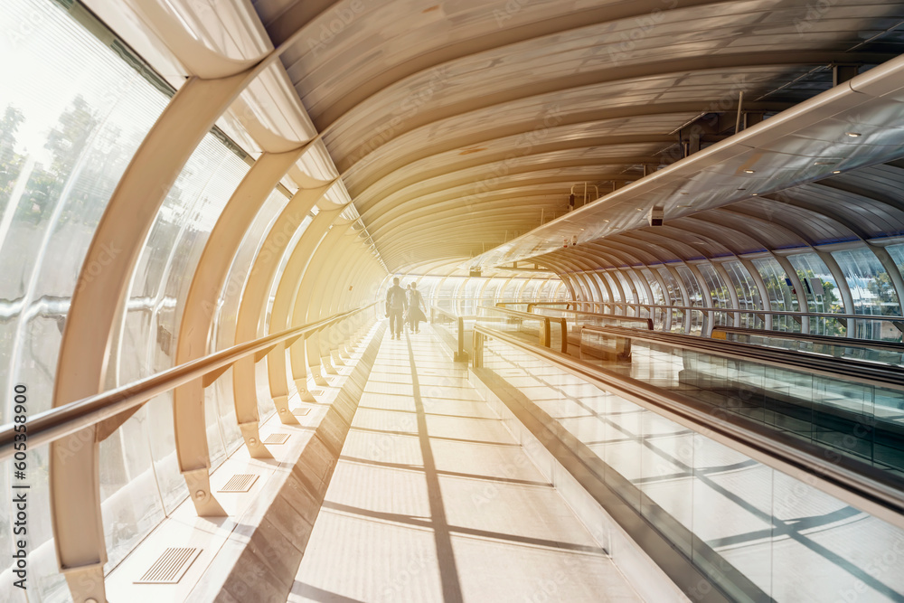 Obraz premium Walking Inside Airport to terminal. Escalator in the airport.