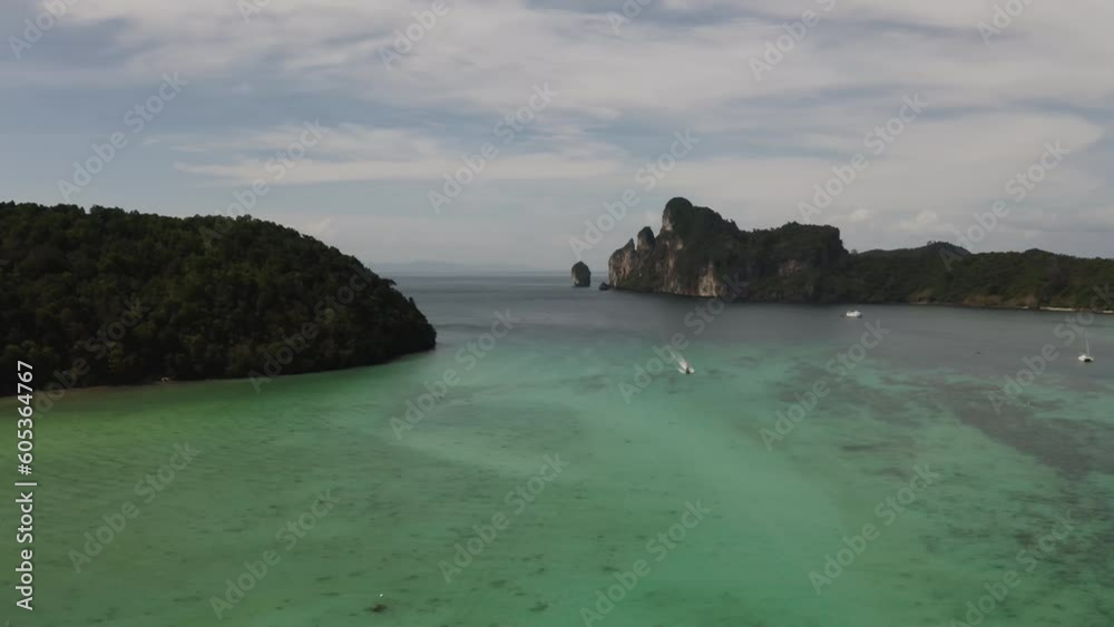 Aerial video of a boat sailing on the shores of Koh Phi Phi Thailand Aerial video of a boat sailing on the shores of Koh Phi Phi Thailand