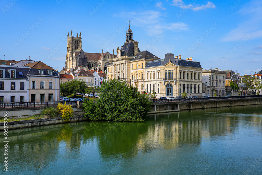 Reflection of Saint Stephen's cathedral overlooking the City Hall of Meaux in the Marne river in the Seine et Marne Department near Paris, France