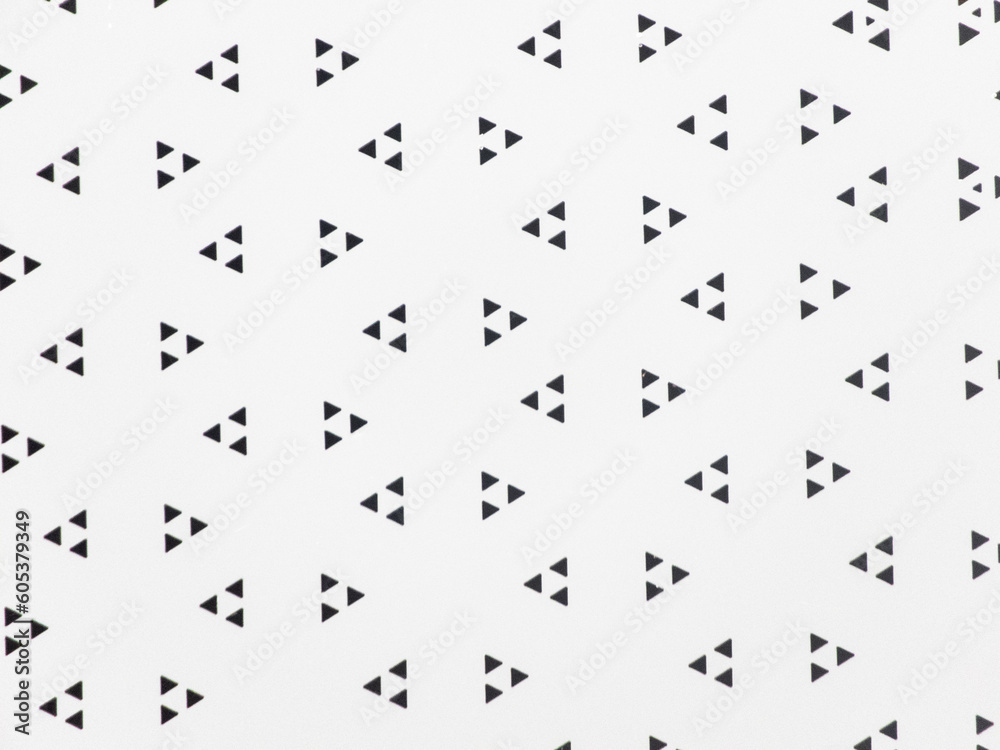 Naklejka premium Arrow-shaped triangular perforated sheet Eye-catching triangular shape The arrow-shaped surface adds to the uniqueness and beauty of this steel plate.The invention of an arrow-shaped plate. close up.