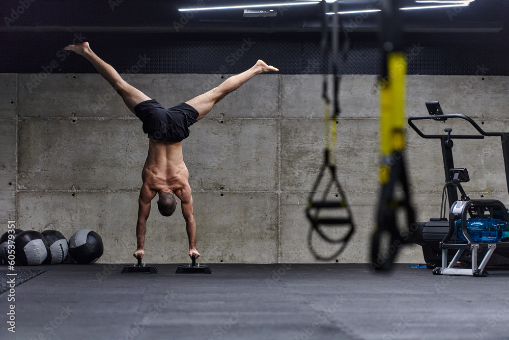 A muscular man in a handstand position, showcasing his exceptional ...