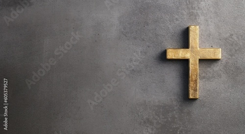 Golden cross on the concrete wall