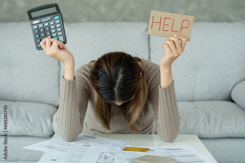 Stressed and headache asian woman with large bills or invoices no money to pay to expenses and credit card debt. shortage, Financial problems, mortgage, loan, bankruptcy, bankrupt, poor, empty wallet Stressed and headache asian woman with large bills or invoices no money to pay to expenses and credit card debt. shortage, Financial problems, mortgage, loan, bankruptcy, bankrupt, poor, empty wallet