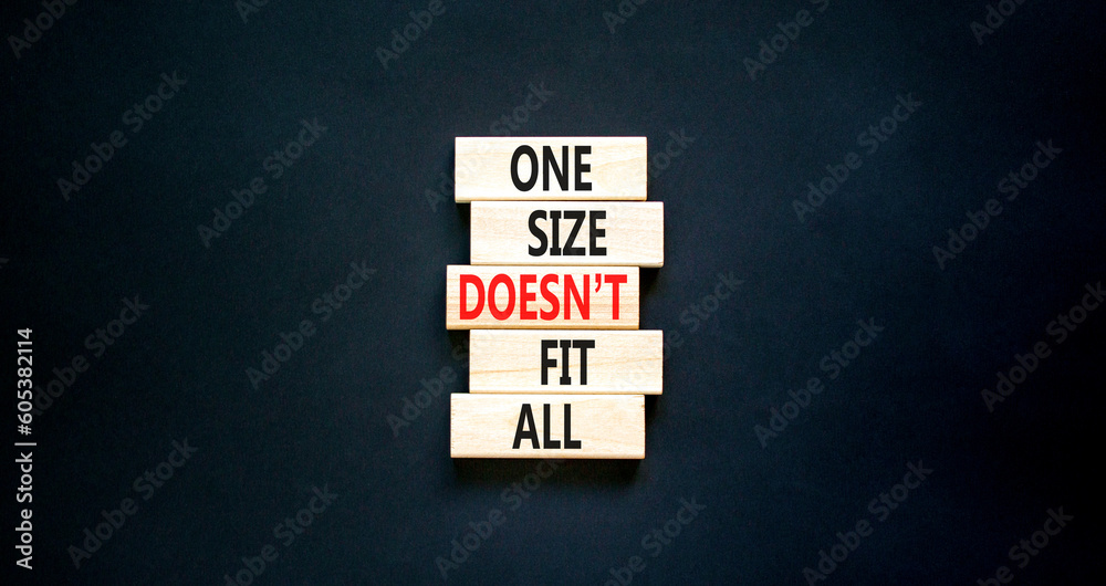One size does not fit all symbol. Concept words One size does not fit all on wooden blocks. Beautiful black table black background. One size does not fit all business concept. Copy space. One size does not fit all symbol. Concept words One size does not fit all on wooden blocks. Beautiful black table black background. One size does not fit all business concept. Copy space.