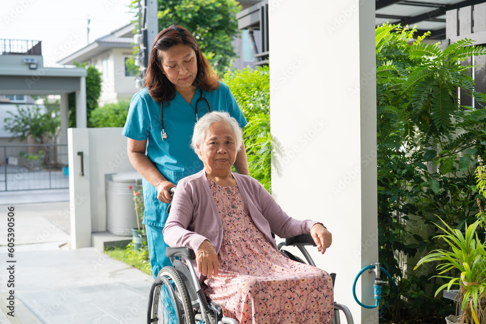 Φωτογραφία Caregiver help and care Asian senior woman patient sitting on wheelchair to ramp in hospital, healthy strong medical concept